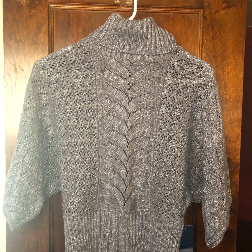 Bell sleeve sweaterBy: Ann Klein